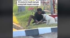 Viral Video Pria Makan Nasi Bungkus bersama Anjing, Momenya Bikin Haru